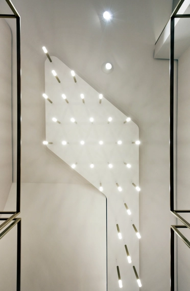 shop design - Reconstruction and new design of a shop - Blue Lemon Basel - store ceiling lamp illumination detail